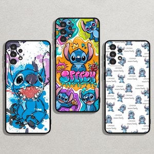 May include: Three phone cases featuring a blue cartoon character with a stitch-like design. The first case has a white background with blue, pink and yellow paint splatters. The second case has a white background with a colourful graffiti design. The third case has a white background with a repeating pattern of the blue cartoon character.
