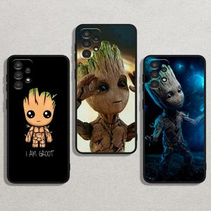 May include: Three black phone cases featuring the character Groot from Guardians of the Galaxy. One case has a cartoon Groot with the text "I AM GROOT". The other two cases have detailed images of Groot in different poses. The cases are likely for a Samsung or similar phone.