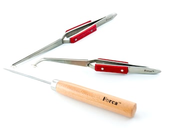 May include: Three tools for crafting or jewelry making. Two tweezers with red handles and a small awl with a wooden handle. The tweezers and awl are labeled "Forca".