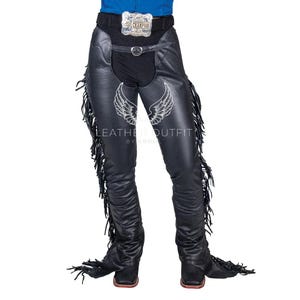 May include: Black leather chaps with long fringe detailing. The chaps feature a belt with a silver buckle that reads "Champion". The design includes a decorative wing graphic and the text "LEATHER OUTFIT BY ABDUL".