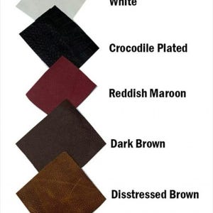 May include: A collection of leather swatches in various colors, including white, black crocodile-plated, reddish maroon, dark brown, and distressed brown. Each swatch is a square shape, with the color names displayed next to each swatch.
