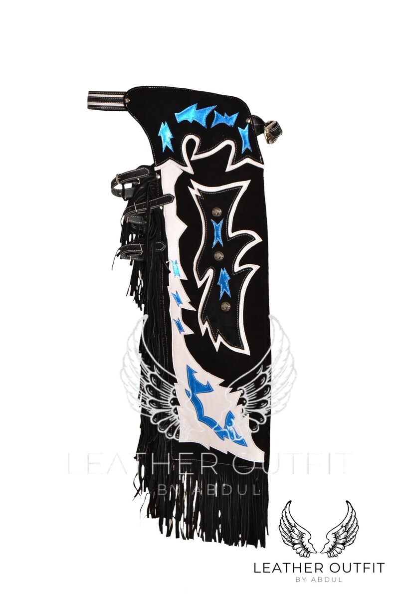 May include: Black leather chaps with white and blue embroidery. The chaps feature a fringe detail and a wing design. The text "Leather Outfit by Abdul" is visible at the bottom of the image.