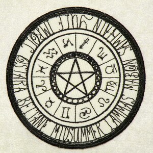 May include: Black and white embroidered patch with a pentagram in the center surrounded by a circle of zodiac symbols and the text "OSKAR BLUME MIDSUMMER LAMMAS MARBON".