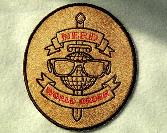 Nerd World Order Iron on Patch on Cowhide Leather 3 7/8" x 4 1/4"