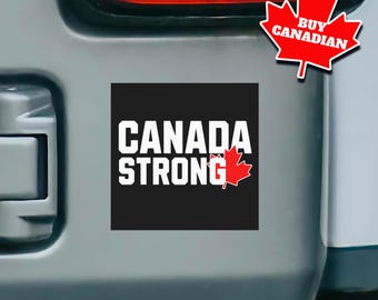 Könnte beinhalten: Ein schwarz-weißer Aufkleber mit dem Text "CANADA STRONG" und einem roten Ahornblatt. Der Aufkleber befindet sich auf einem grauen Auto.