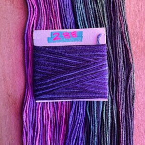 May include: A skein of purple embroidery floss with a label that reads "288".