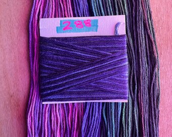 May include: A skein of purple embroidery floss with a label that reads "288".