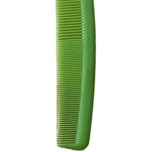 May include: A green plastic comb with fine teeth, designed for hair grooming. The comb is a solid, vibrant green color and has a smooth, rounded handle. The teeth are evenly spaced.