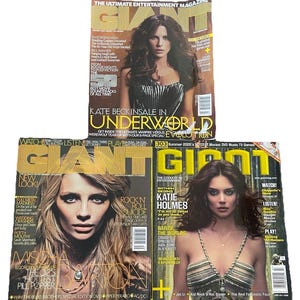 May include: Three issues of Giant magazine are stacked. The top magazine features Kate Beckinsale. The middle magazine features Mischa Barton. The bottom magazine features Katie Holmes. Each magazine has a different cover.