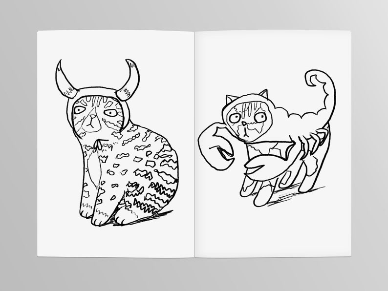 May include: A black and white line drawing of two cats wearing costumes. One cat is wearing a bull costume with horns and the other is wearing a scorpion costume with a tail.