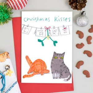 Lustige Weihnachtskatzen-Karte Weihnachtsküsste Ginger Katze und niedliche getigerte Katze
