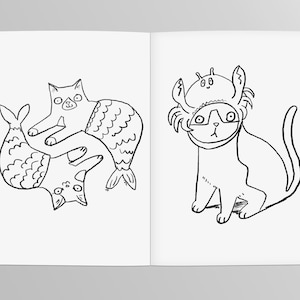 May include: Two black and white line drawings of cats. The first cat is wearing a mermaid tail and is holding another cat with a fish tail. The second cat is wearing a crab costume.