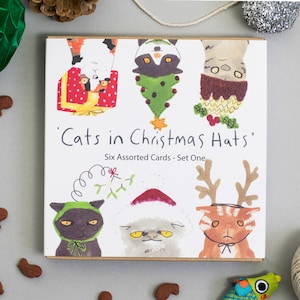 Katten in kerstmutsen Set van zes ontwerpen: één set