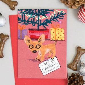 面白い犬のクリスマスカード プレゼントを残しました
