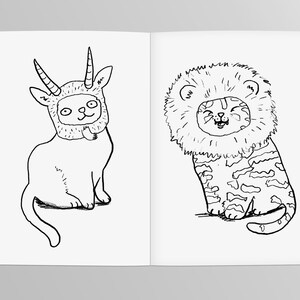 May include: A black and white line drawing of a cat wearing a goat costume and a cat wearing a lion costume.