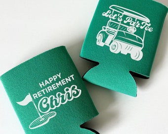 May include: Two green can coolers with white text and graphics. One says "Happy Retirement Chris" with a golf flag graphic. The other says "Let's Par Tee" with a golf cart graphic. Both are made of a foam material.