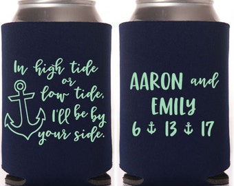 May include: Two navy blue foam can coolers featuring light green text and graphics. One side displays an anchor and the phrase In high tide or low tide, I'll be by your side. The other side shows the names AARON and EMILY with the date 6 13 17.