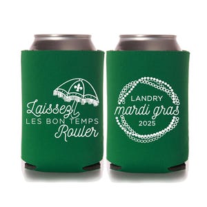 May include: Two green can coolers with white text and designs. One cooler features a Mardi Gras umbrella with the text "Laissez Les Bon Temps Rouler". The other cooler features a circle of beads with the text "Landry Mardi Gras 2025".