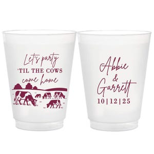 May include: Two white plastic cups with burgundy text and graphics. One cup says "Let's party 'til the cows come home" with cow illustrations. The other cup says "Abbie & Garrett 10|12|25".