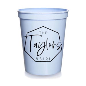 May include: Light blue plastic cup with a black hexagonal design that says "The Taylors 8.31.21".