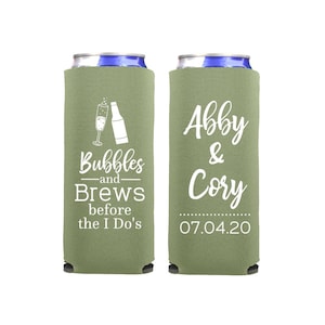 May include: Two green and white personalized can coolers. One cooler says "Bubbles and Brews before the I Do's" with a champagne flute and bottle graphic. The other cooler says "Abby & Cory 07.04.20".
