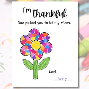 May include: A white card with the text "I'm thankful" in black script. Below, it reads "God picked you to be my Mom." A colorful flower illustration with a yellow center and a green stem is featured. The card is signed "Love, Avery."