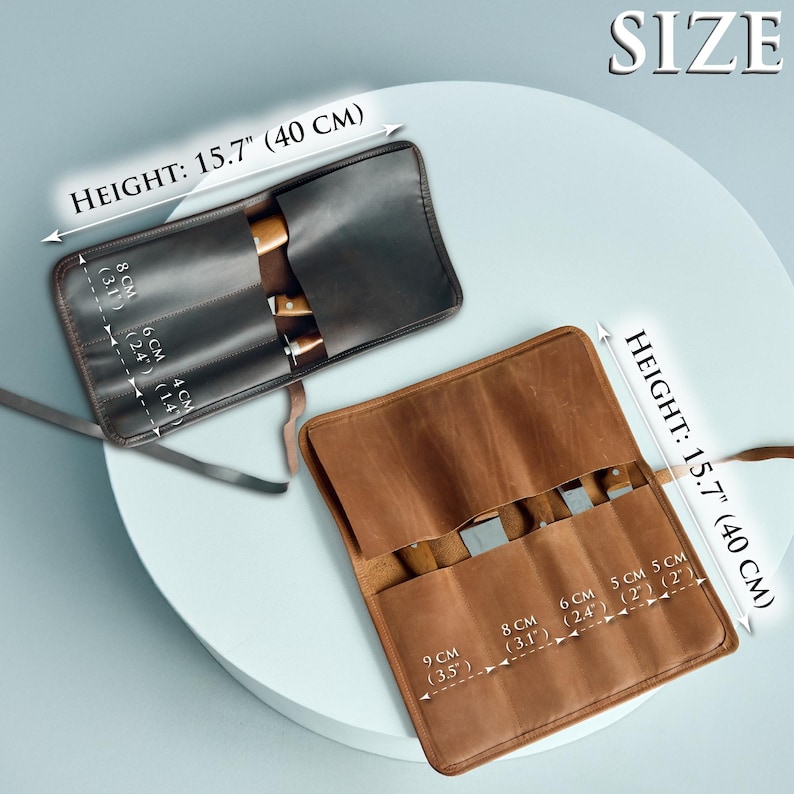 May include: Two leather knife rolls, one black and one brown, are displayed. Each roll is open, revealing the slots for knives. The height of each roll is 15.7 inches (40 cm). The text "SIZE" is visible.