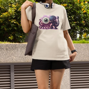 Alien Earth T. Ocellus Unisex T-Shirt: Ring-Spun Cotton Chibi Monster Graphic