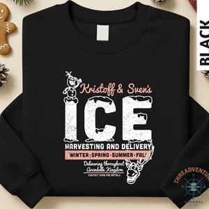 A black long-sleeved shirt with a graphic design featuring text and illustrations related to Kristoff & Sven's Ice Harvesting and Delivery service.