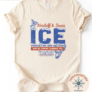 The image is a t-shirt with a graphic design featuring a snowman and a blue snowman. The design includes text and illustrations related to Kristoff & Sven's Ice Harvesting and Delivery service.