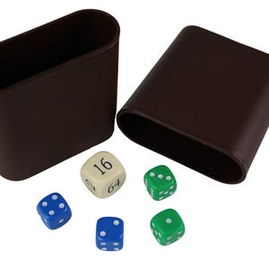 May include: Two dark brown oval-shaped containers with the word STAUNTON embossed on the side, accompanied by five dice. One cream-colored die features the numbers 2, 16, and 64, while two blue dice and two green dice display standard white pips.