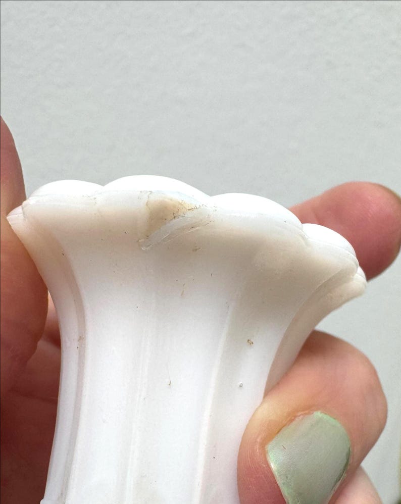 1/4 inch size chip on underside of lip of tall scalloped mouth vase