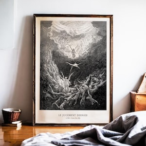 May include: A framed black and white print of a dramatic scene, featuring figures in a chaotic composition. The artwork, with a dark wooden frame, depicts a celestial event with detailed figures and text at the bottom.