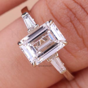 3 Carat IGI Certified E Color VVS2 Clarity Emerald Cut Lab Grown Diamond Three Stone Engagement Ring, Side Tapered Baguettes Trilogy Ring