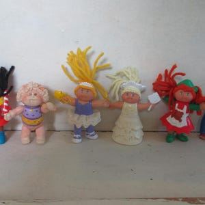 Vintage lot of early 1990's and 1980's Cabbage Patch collectible figurines Happy Meal toys 6 dolls figures 1 has broken foot