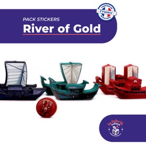 May include: A selection of toy boats in blue, green, and red, with white sails, and a red sticker with a crab design. The text "River of Gold" is displayed above the boats. The image also includes the text "Fabriqué en France".