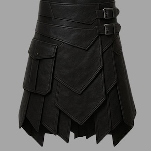 May include: Black leather skirt with a unique layered design. Features two pockets and two buckle closures. The skirt has a geometric, asymmetrical hemline and a structured silhouette.