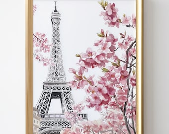 May include: A framed watercolor painting of the Eiffel Tower in Paris, France. The tower is depicted in black and white, while the background features a pink cherry blossom tree in full bloom.