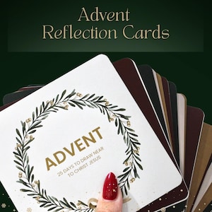 May include: Advent Reflection Cards with a wreath design around the word "ADVENT". The cards are white with gold text and a green wreath. The text "25 DAYS TO DRAW NEAR TO CHRIST JESUS" is also visible. The background is dark green.