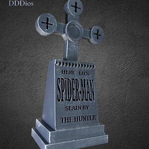 May include: A gray tombstone with a cross-shaped top. The tombstone reads "HERE LIES SPIDER-MAN SLAIN BY THE HUNTER". The logo "DDDios" is in the upper left corner. The background is a textured gray.