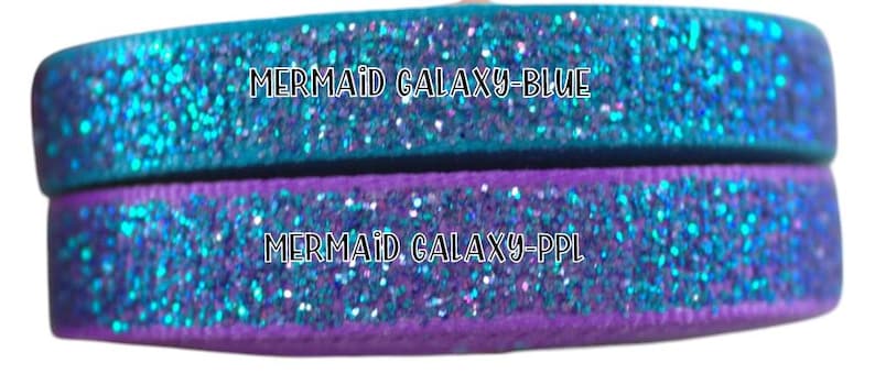 May include: Two rolls of iridescent blue glitter ribbon with the text "MERMAID GALAXY-BLUE" and "MERMAID GALAXY-PPL" printed on them.