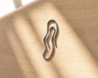 Golvende paperclips • Gekietelde paperclips