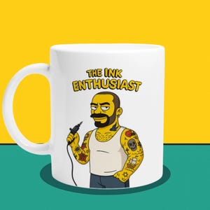 The Tattoo Guy Mug The Tattoo Guy Cartoon Mug – Inked Lifestyle Gift with Bold Character Style
