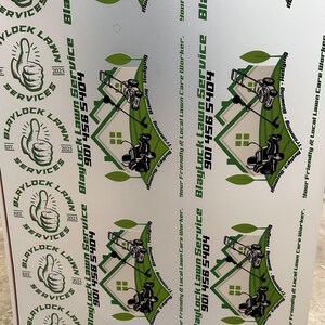 May include: White printed sheet featuring multiple logos for Blaylock Lawn Service. The logos include a thumbs-up graphic, the company name, and a phone number. Additional graphics depict a lawnmower and a house.