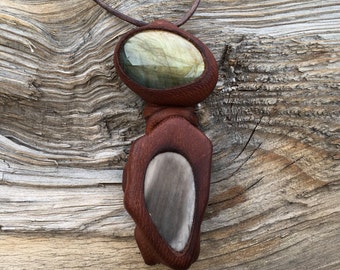 Earth Passage- This Stream of Life  Amulet features Labradorite and Petrified Wood in a brown leather setting.