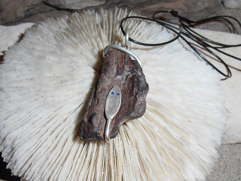 Wood Snake This pendant features a piece of Petrified Wood that has a Silver Snake coiled around it. image 2