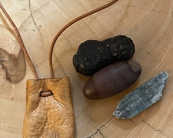 As Above So Below- this Wisdom Pouch features a small deerskin pouch with carving that comes with 3 special stones.