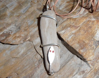 Serpent of Time- This Spiral Seed Pendant features a piece of tumbled Petrified Wood that is Spiral wrapped with a Silver Snake.