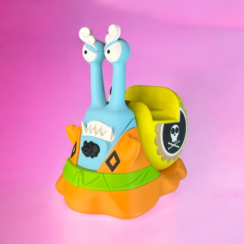 May include: A blue and orange cartoon snail with a yellow shell and a skull and crossbones design. The snail has a toothy grin and large eyes.