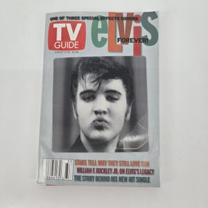 May include: A TV Guide magazine cover with a black and white image of Elvis Presley. The cover includes the text "TV Guide" in red and "Elvis Forever!" in green and orange. The issue is dated August 17-23.
